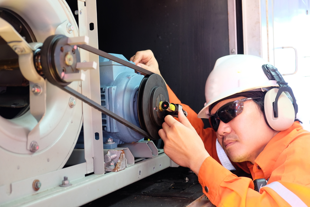 Figure 5: Pulley alignment check with laser pointer of blower and electric motor.