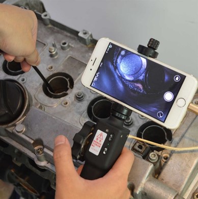 Figure 9: Endoscope connected to mobile phone for visual inspection.