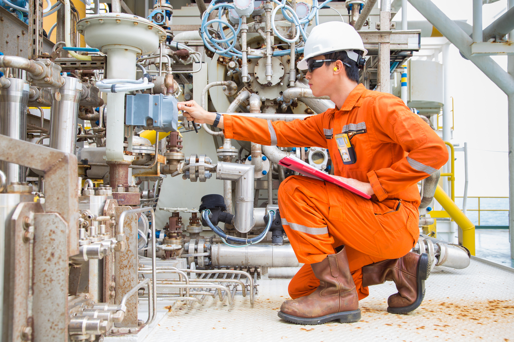 Figure 2: Technician performing visual inspection on electrical junction box.